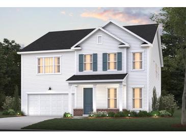 Two-story house with white siding, teal door, and a landscaped front yard at 127 Winding Grove Ln, Moncks Corner, SC 29461
