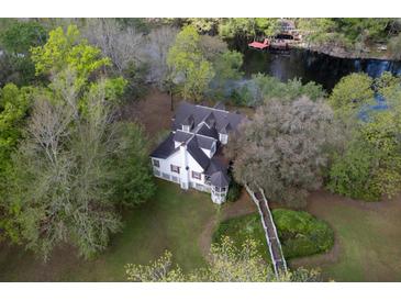 Aerial view of a charming waterfront home with white exterior at 138 Waddell Ln, Ridgeville, SC 29472