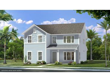 Two-story light blue house with gray metal roof and landscaping at 3 Trailhead Ln, Awendaw, SC 29429