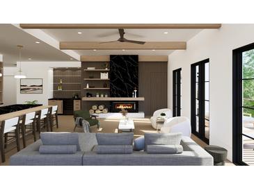 Open concept living room and kitchen with modern fireplace at 211 Seven Farms Dr # 302, Charleston, SC 29492