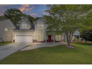 Two story house with front porch and attached garage at 124 Sweet Alyssum Dr, Ladson, SC 29456