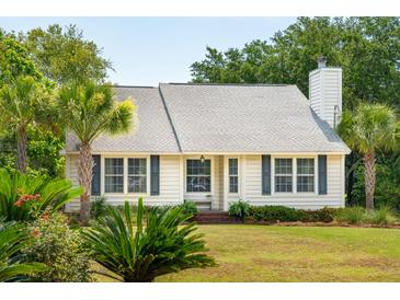 One-story home with white siding, shutters, and palm trees at 1135 Harborgate Dr, Mount Pleasant, SC 29464