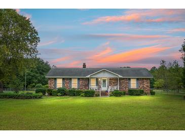Brick ranch home with landscaped yard at 2363 Ranger Dr, Cross, SC 29436