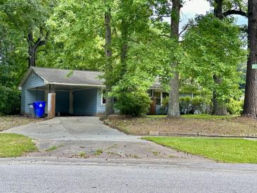 Ranch style home with a carport and mature trees at 2651 Leeds Ave, North Charleston, SC 29405