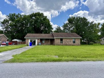 Brick ranch home with a spacious yard at 2819 Shadow Ln, North Charleston, SC 29406
