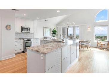 Modern kitchen with granite island and ocean views at 1394/96 Pelican Watch Villas, Seabrook Island, SC 29455
