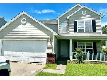 Two-story house with attached garage and landscaping at 506 Holiday Dr, Summerville, SC 29483