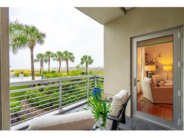 Private balcony with marsh views and comfortable seating at 316 Cooper River Dr, Mount Pleasant, SC 29464