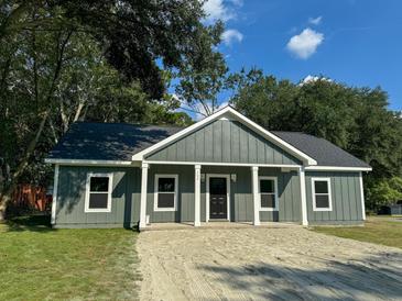 Newly built gray house with a sandy driveway at 102 Whitesville Rd, Moncks Corner, SC 29461