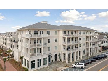 Exterior view of a multi-story building with balconies and retail spaces at 301 Longshore St # 441, Charleston, SC 29492