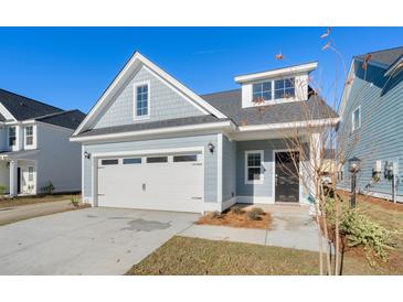 Charming craftsman style home with two-car garage and nicely landscaped yard at 425 Grove End Rd, Moncks Corner, SC 29461