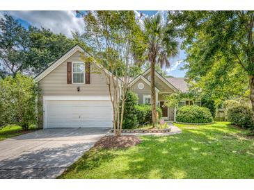 Charming one-story home with a two-car garage and manicured lawn at 2851 Curran Pl, Mount Pleasant, SC 29466