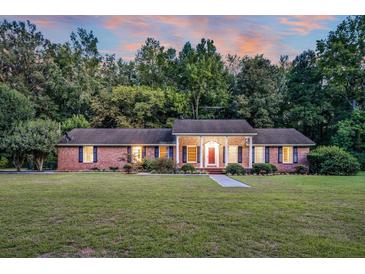Brick ranch house with a large front yard at 598 Maple Branch Rd, Reevesville, SC 29471