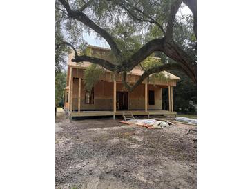 New house under construction with a large tree in the front yard at 108 S Williams Dr, Moncks Corner, SC 29461