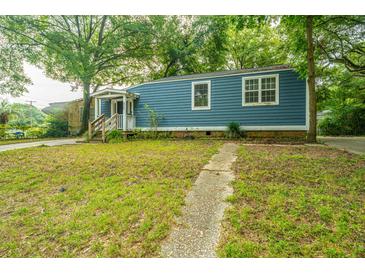 Blue house with a wooden porch and a grassy yard at 2355 Cambridge Ave, North Charleston, SC 29405