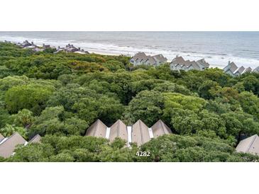 Aerial view of coastal community with oceanfront homes and lush greenery at 4282 Mariners Watch, Kiawah Island, SC 29455