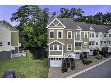 Townhome community with pond and lush green spaces at 5911 Steward St # 24, Hanahan, SC 29410