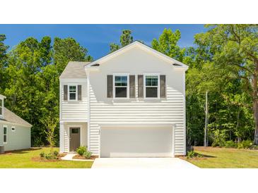 Two-story home with white siding, gray shutters, and a two-car garage at 353 Willows Crescent Way, Moncks Corner, SC 29461