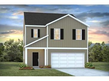 Two-story house with gray siding, white garage door, and landscaping at 177 Carolina Groves Blvd, Moncks Corner, SC 29461