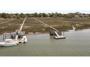 Waterfront property with private dock and boat slips at 218 E Huron Ave, Folly Beach, SC 29439