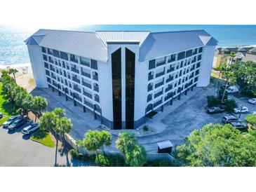 Oceanfront building with parking and a pool, offering stunning views at 9002 Palmetto Dr # 512, Isle of Palms, SC 29451