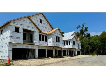 New townhomes under construction with attached garages at 420 Carolina Cherry Ct # 102, Charleston, SC 29414