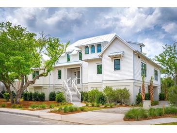Two story white house with gray roof and landscaping at 1467 Alligator Creek Ct # 104, Awendaw, SC 29429