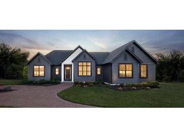 Modern two-story home with dark siding and brick walkway at 00 Handsome Dr, Johns Island, SC 29455