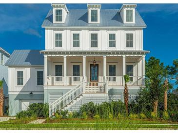 Two-story home with white siding, metal roof, and front porch at 1449 Jeremy Cay Ct, Awendaw, SC 29429