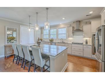Spacious kitchen with granite countertops, stainless steel appliances, and an island at 620 Chigwell Springs Ln, Summerville, SC 29486