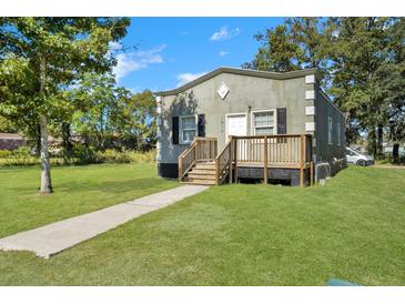 Quaint bungalow with front porch and well-maintained lawn at 1910 Kerry St, North Charleston, SC 29406