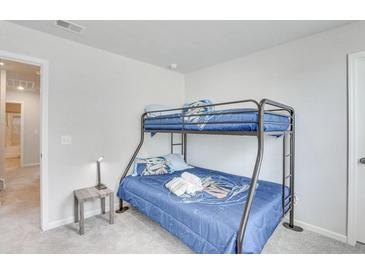 Bedroom with bunk beds and ample floor space at 229 Camellia Bloom Dr, Moncks Corner, SC 29461