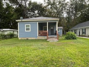 Quaint bungalow with a covered porch and yard at 5309 Good St, North Charleston, SC 29406