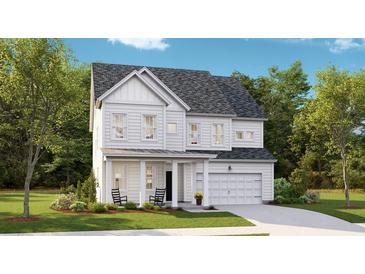 Two-story farmhouse style home with gray roof and white siding at 1866 Nola Run, Summerville, SC 29485