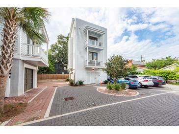 Modern three-story home with private parking and courtyard at 9 Iron Frg Aly, Charleston, SC 29403