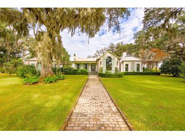 Elegant home with brick walkway and lush landscaping at 4285 Clover Hill Rd, Green Pond, SC 29446