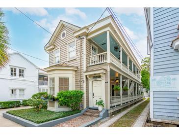 Two story home with wrap around porch and side yard at 175 Wentworth St # A, Charleston, SC 29401