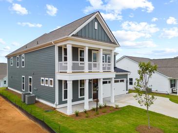 Two-story craftsman style home with gray siding and white trim at 331 Hillman Trail Dr, Moncks Corner, SC 29461