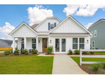 Charming farmhouse exterior with white siding and landscaping at 367 Wappoo Trace Ln, Summerville, SC 29486