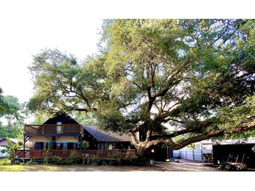 Charming home nestled under a large tree at 705 Hildebrand Dr, Bonneau, SC 29431