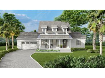 Two-story farmhouse with front porch, gray roof, and white siding at 5209 Seewee Rd, Awendaw, SC 29429