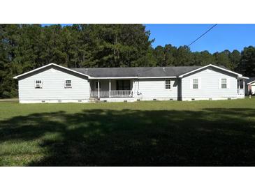 Ranch-style home with gray siding, white trim, and a covered porch at 8266 N Highway 17, McClellanville, SC 29458
