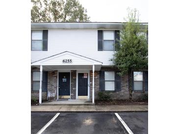 Front view of a two-story house with two entrances and brick accents at 6255 Lucille Dr # 19-C, North Charleston, SC 29406