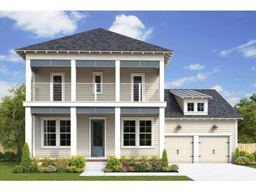 Two-story house with beige siding, gray trim, and a double-car garage at 1188 Reserve Ln, Awendaw, SC 29429