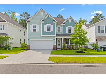 Two-story light teal house with white accents at 180 Cherry Grove Dr, Summerville, SC 29483