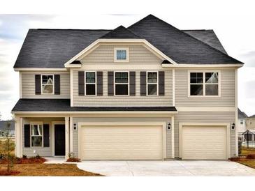 Two story house with a three car garage and neutral colors at 153 Seaton Street, Summerville, SC 29486