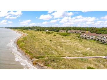 Beachfront property with a boardwalk leading to the ocean at 1331 Pelican Watch Villas, Seabrook Island, SC 29455