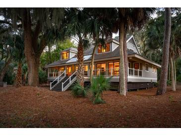 Charming one-story home nestled in a lush, wooded setting at 2588 High Hammock Rd, Johns Island, SC 29455