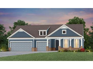 Two-story home with gray siding, brick accents, and a three-car garage at 539 Pink Lily Ln, Summerville, SC 29486