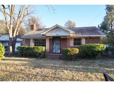 Brick ranch house with mature landscaping at 150 M L King Blvd, Saint Stephen, SC 29479